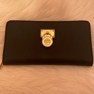 Black MK zip wallet.